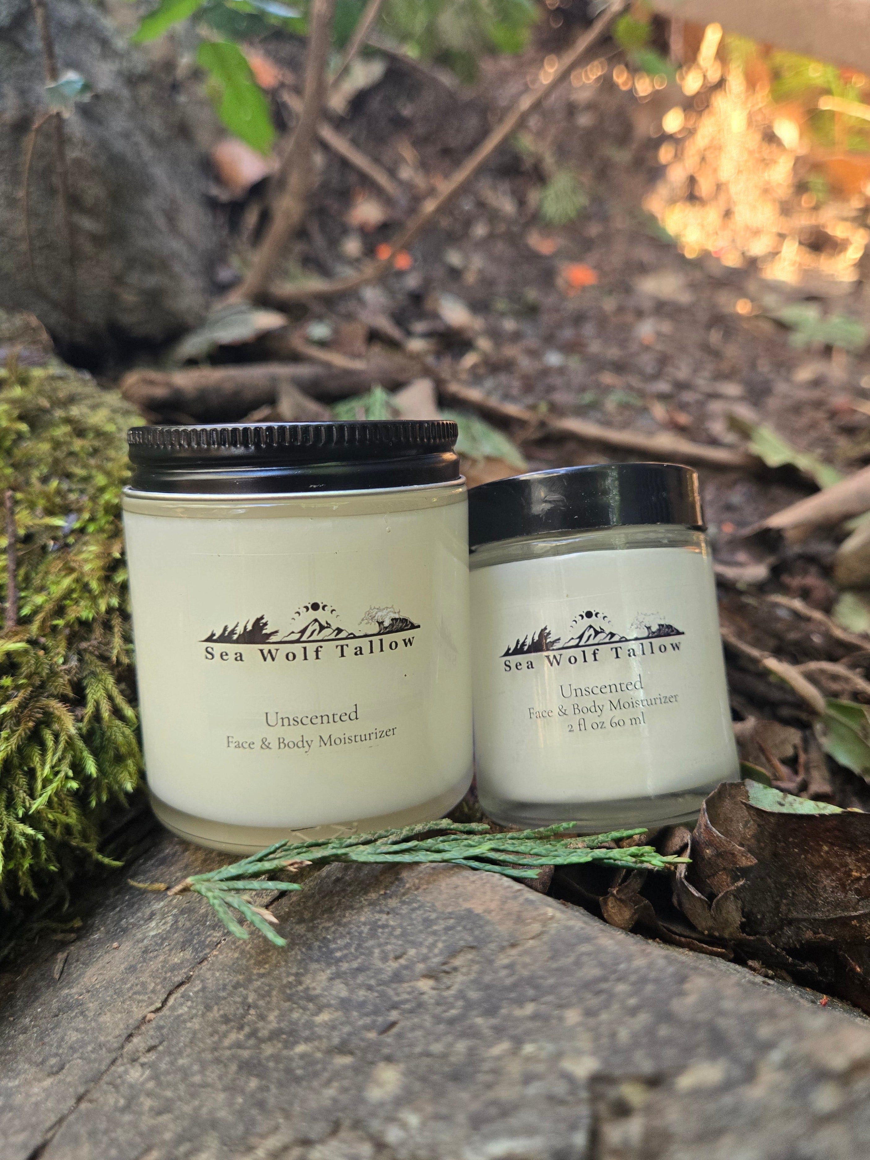 Two jars with black lids on a natural background